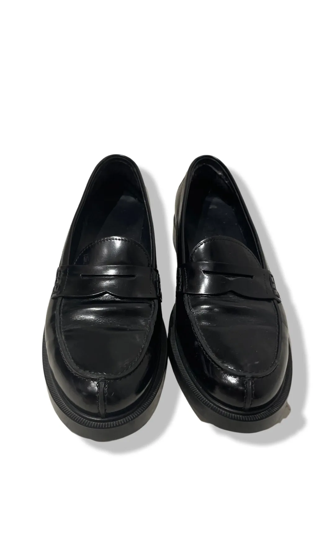 Black loafers by Tod's.